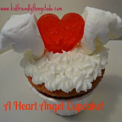 A Flying Heart! All you need to decorate this cupcake are 2 marshmallows, and a heart lollipop!