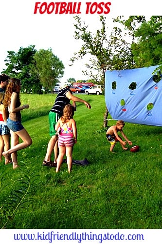 A Football Toss Game made from an old twin bed sheet! This is great for summer picnics, and birthday parties!
