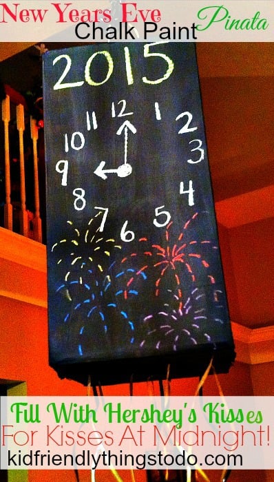 Such a fun thing to do with or without the kids! A box painted with chalk so you can change the time as the night progresses! Fill it with Hershey's Kisses - so kids can have their Kisses at Midnight! - Kid Friendly Things To Do .com