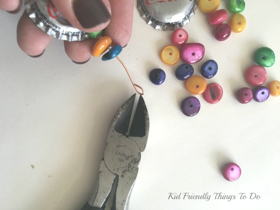 Turning a Coca-Cola Bottle into a Wind Chime. The New Colorful Diet Coke Bottle Wind Chime Craft - KidFriendlyThingsToDo.com