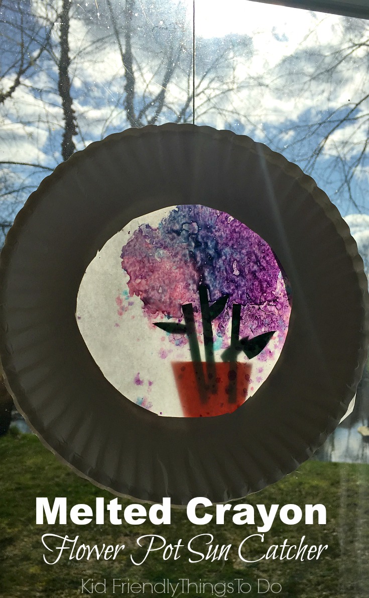 A Flower Pot Sun Catcher with Melted Crayons! Perfect for Mother's Day, spring and summer crafts - KidFriendlyThingsToDo.com