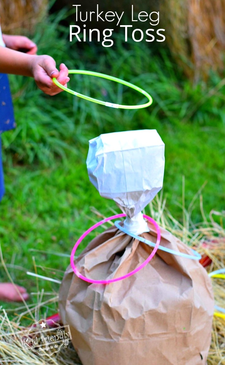 Turkey Leg Ring Toss Thanksgiving Game for Kids and Family - Use glow in the dark necklaces for night time fun! Perfect for preschool and elementary school parties. It's so easy to make and fun for everyone! fall and harvest party idea - www.kidfriendlythingstodo.com