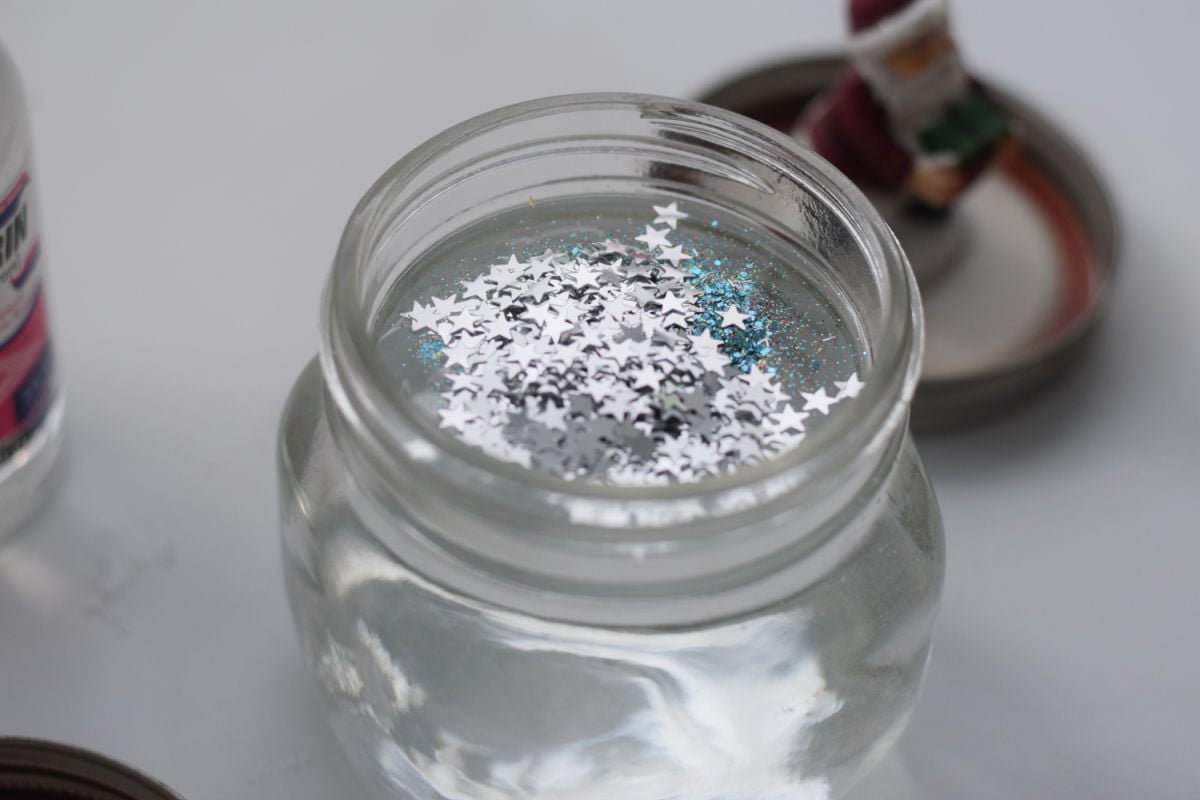 adding glitter to snow globe water 
