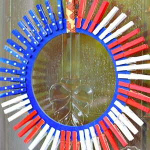 Easy 4th of July DIY Clothespin wreath. fun to do with the kids! Make a clothespin patriotic wreath for summer fun and a great decoration - www.kidfriendlythingstodo.com Memorial Day and Labor Day craft