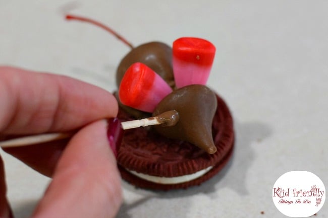 Chocolate Covered Cherry Valentine Mice On A Red Velvet Cookie for a kids fun food treat - www.kidfriendlythingstodo.com