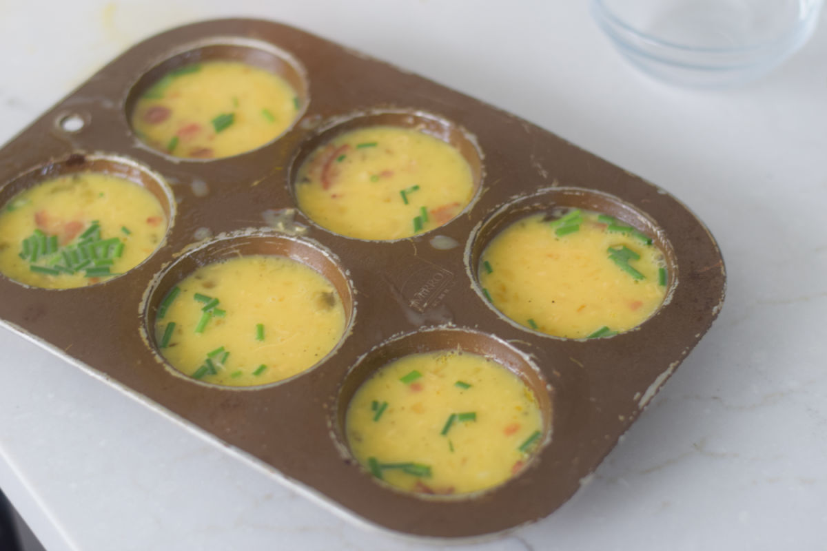 eggs in a muffin tin before baking 