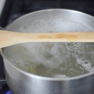 wooden spoon over boiling water