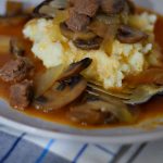 braised beef stew over mashed potatoes