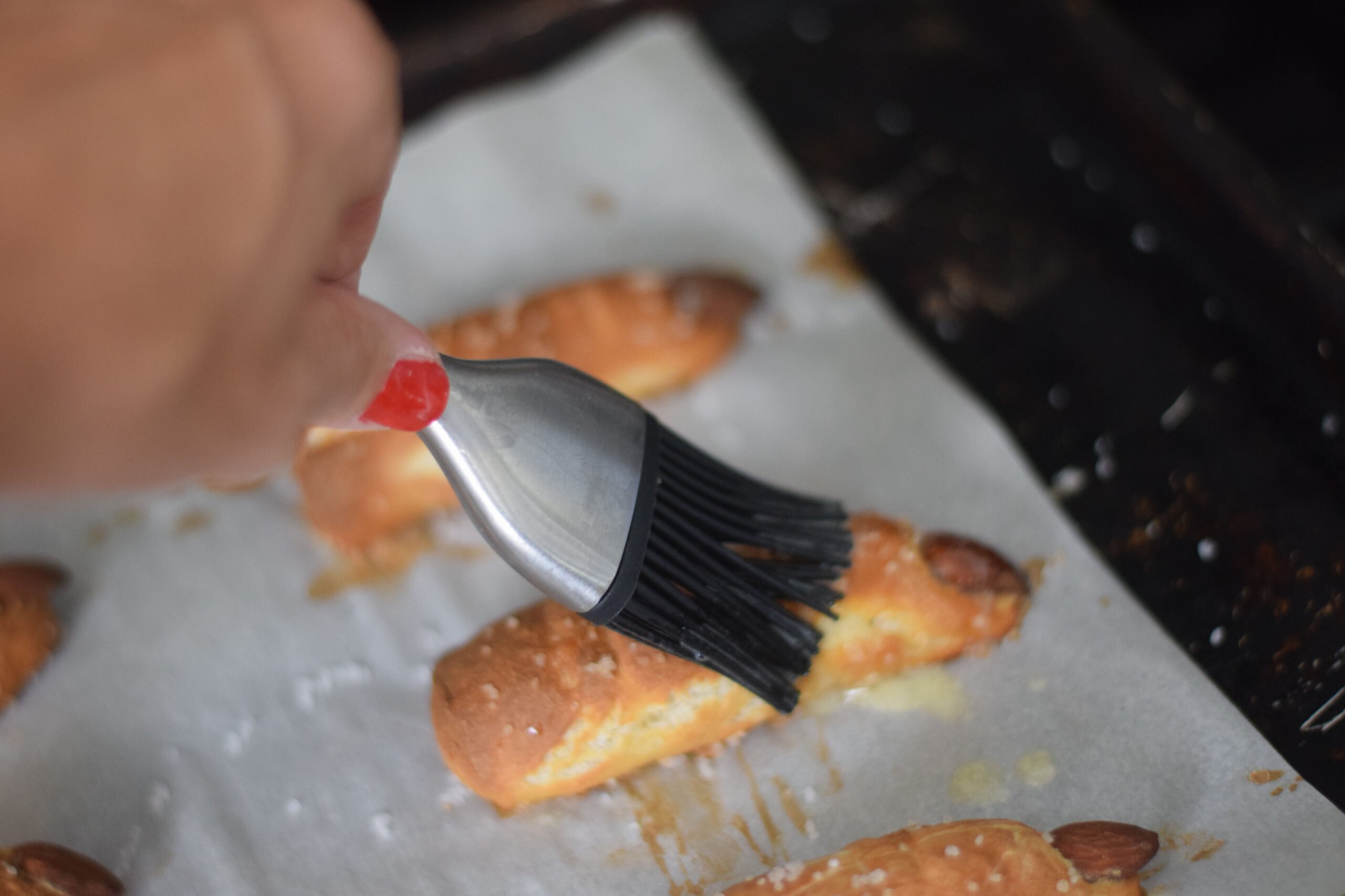 brush melted butter on witch pretzel finger 