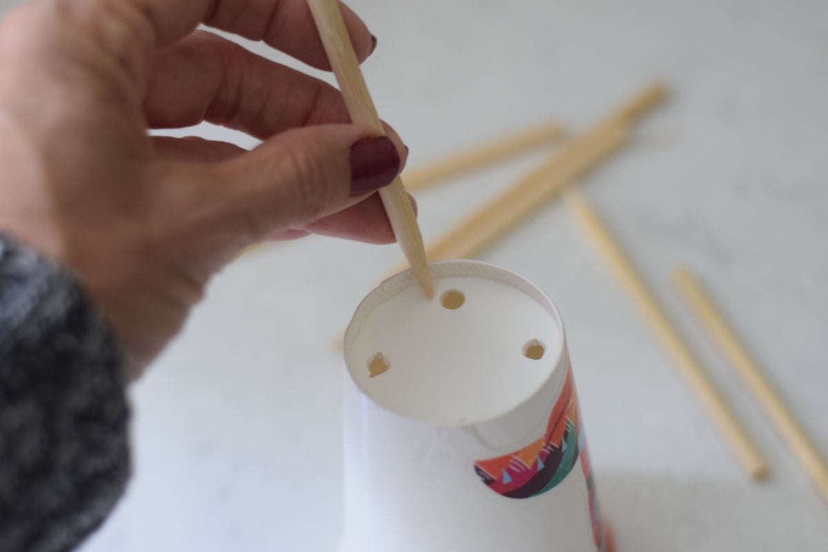 poking holes in paper cup 