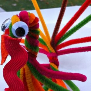 Pipe Cleaner Turkey Treat Holder and Craft for Thanksgiving - KidFriendlyThingsToDo.com