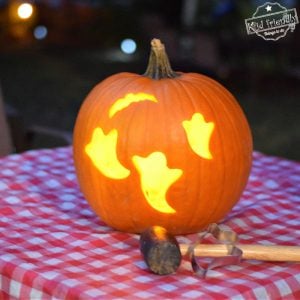 carving pumpkins with cookie cutters and a mallet