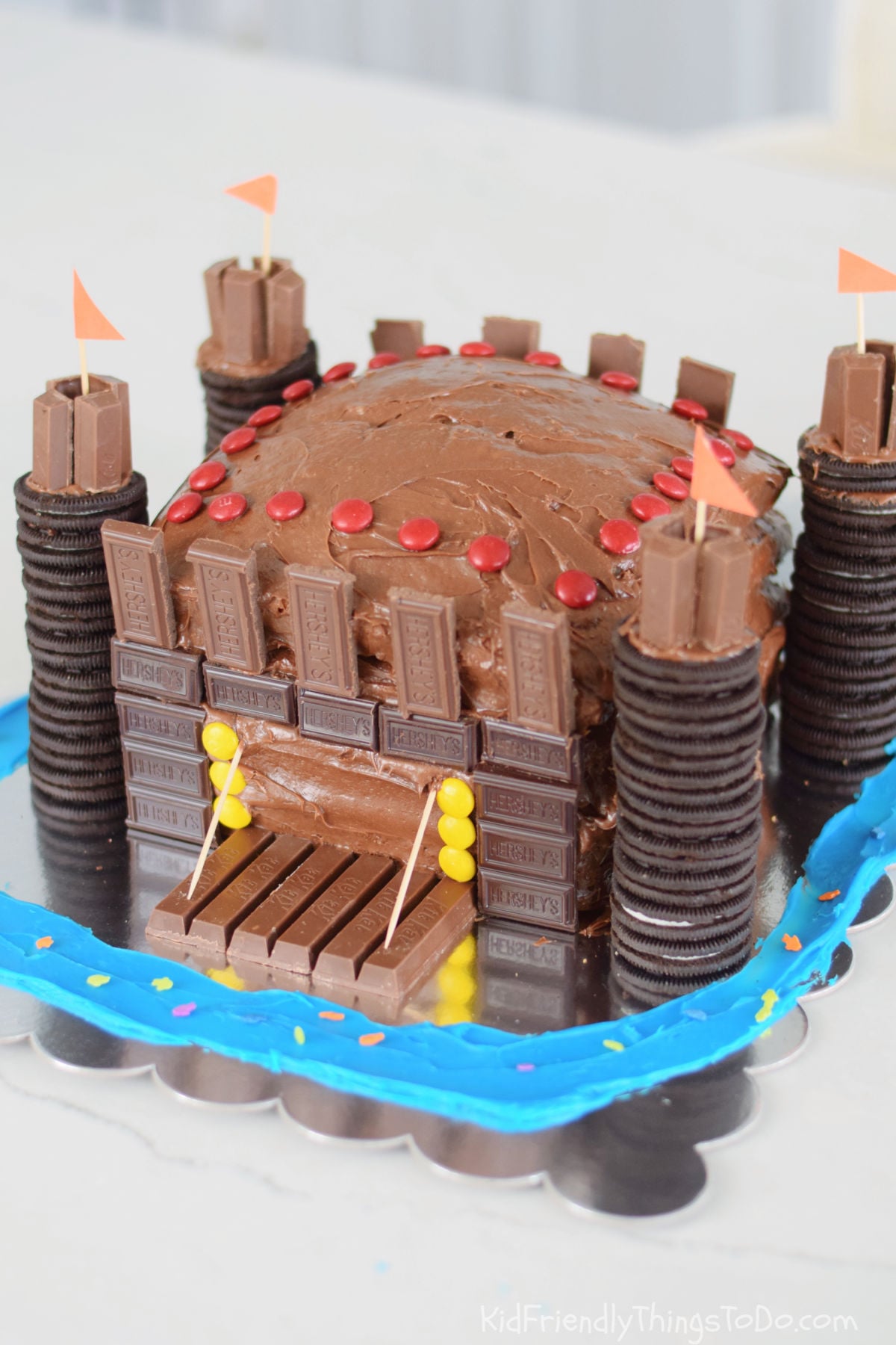 castle cake with candy and cookies for a kid's birthday party
