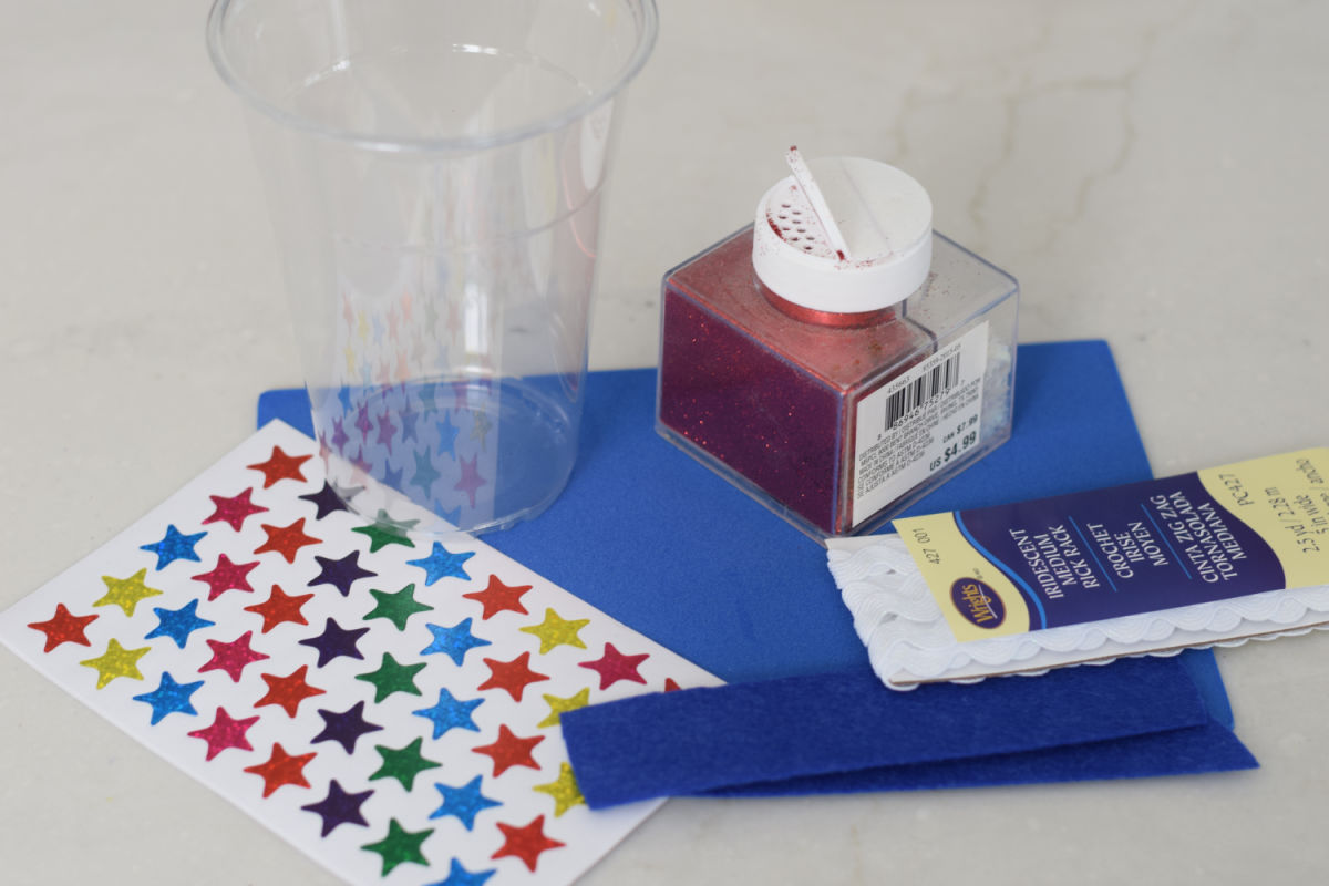 supplies for making an Uncle Sam hat from a clear plastic cup