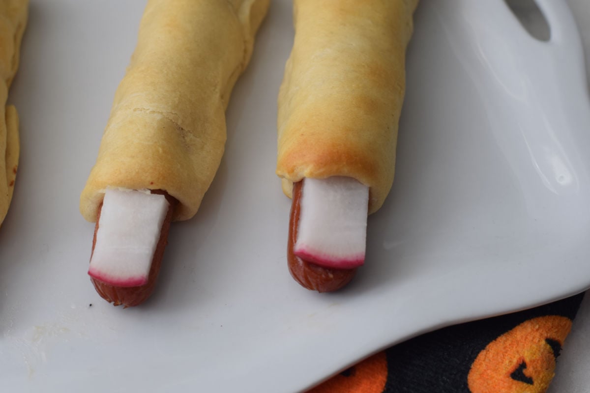 making bloody fingernail Halloween hotdogs