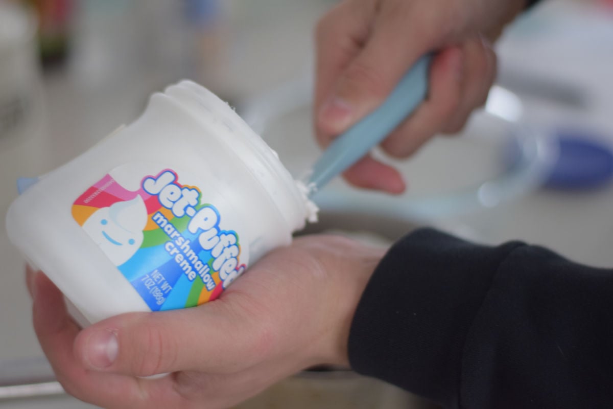 scooping fluff into fudge 