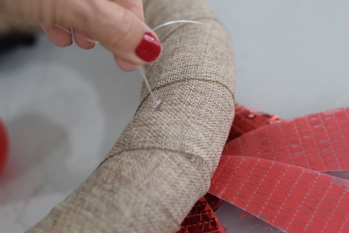 attaching bow to wreath