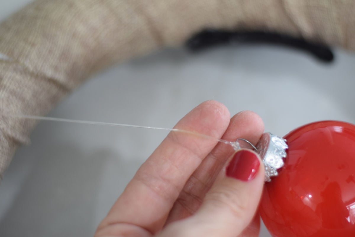 gluing red ornament to Rudolph wreath