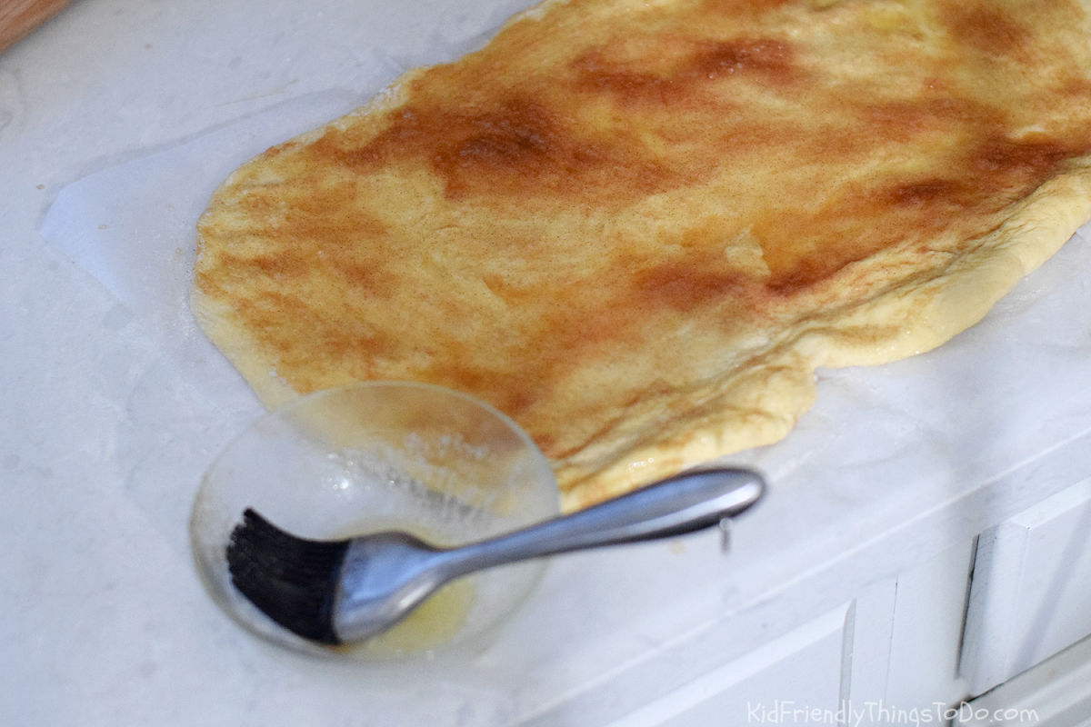 rolled out dough with butter and cinnamon sugar 