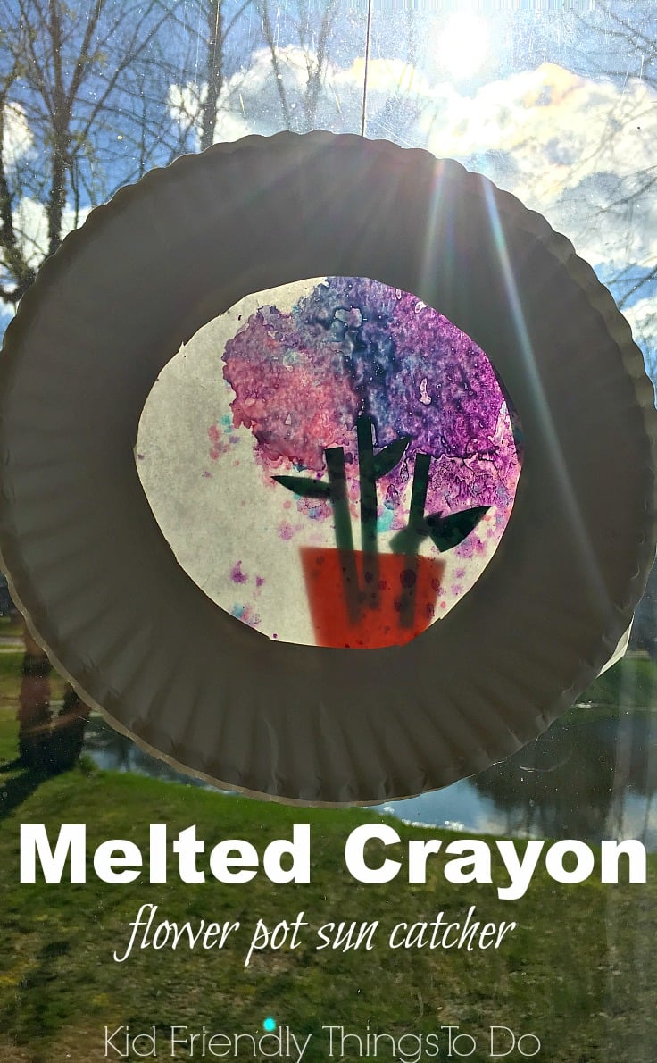 A Flower Pot Sun Catcher with Melted Crayons! Perfect for Mother's Day, spring and summer crafts - KidFriendlyThingsToDo.com