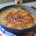 peach root beer baked beans with bacon in cast iron skillet campfire recipe