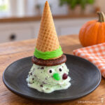 melting witch ice cream treat with mint ice cream face and a sugar cone with cookie hat halloween treat