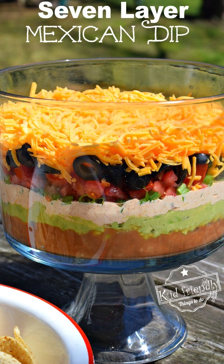 Easy and Delicious Seven Layer Mexican dip. Perfect appetizer for large crowds, parties and barbeques! www.kidfriendlythingstodo.com