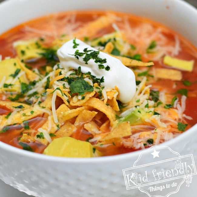 Easy and Healthy Slow Cooker Chicken Tortilla Soup Recipe - The most delicious tortilla soup, ever! The best! So easy too. www.kidfriendlythingstodo.com
