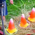 Easy DIY Candy Corn Ring Toss with Glow Necklaces for a Fun Fall, Halloween, or Thanksgiving Game - perfect for kid's school party, harvest parties, or family fun! www.kidfriendlythingstodo.com