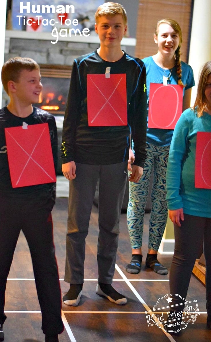 Human Tic-Tac-Toe - A Valentine Party Game to Play With Kids, Teens and Adults. This is such a fun game. Perfect for holiday parties like Valentine's Day, Christmas and even New Years Eve! www.kidfriendlythingstodo.com