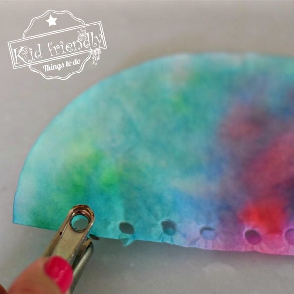 punching holes for a Jellyfish coffee filter craft