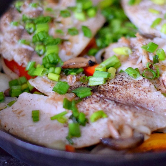 cast iron pan fried fish fillet meal