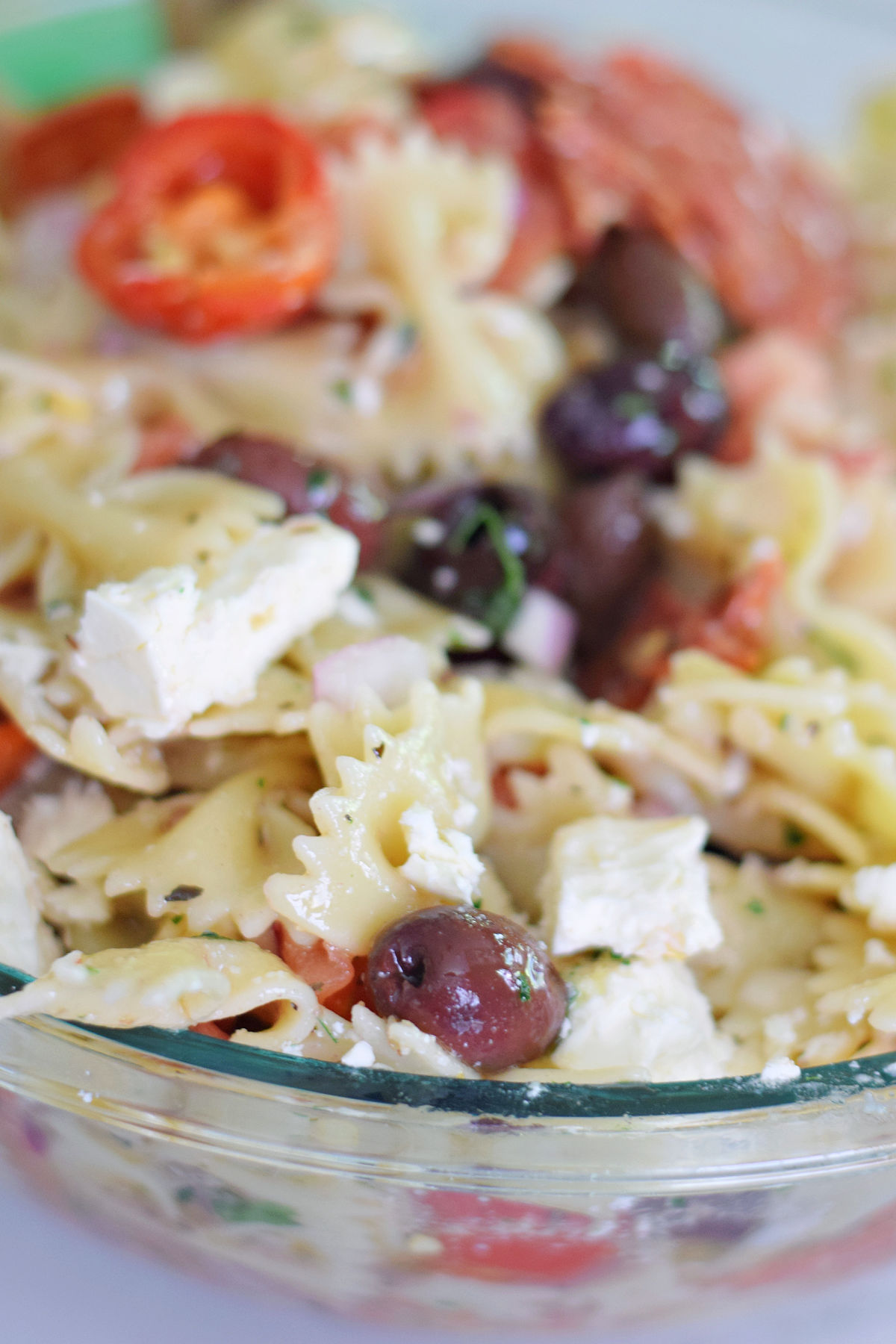 Bow tie Greek pasta salad with feta, sweet cherry peppers, olives, and tomatoes