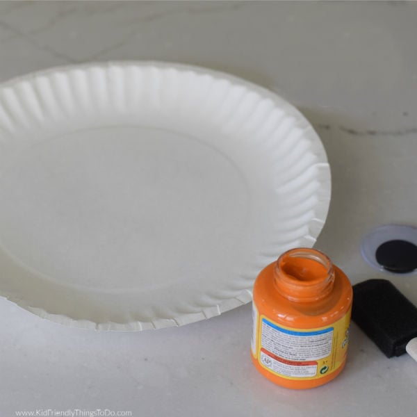 paper plate with orange paint 