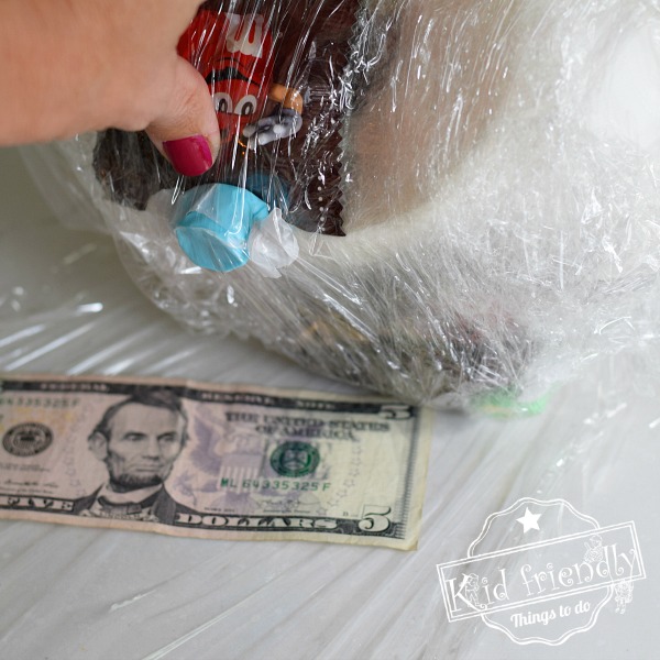 Saran Wrap Candy Ball Game for Holiday School Parties - Arts and Bricks