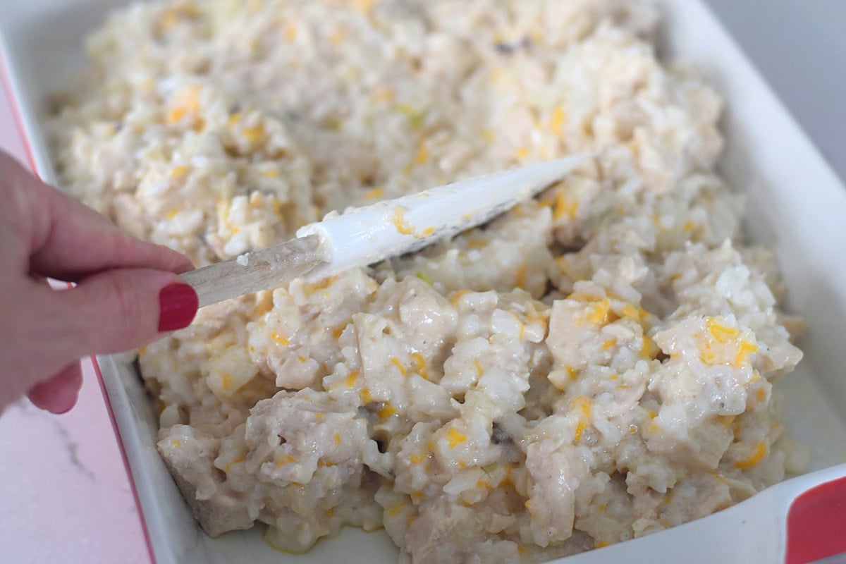Cooked chicken and rice mixed with creamy casserole filling