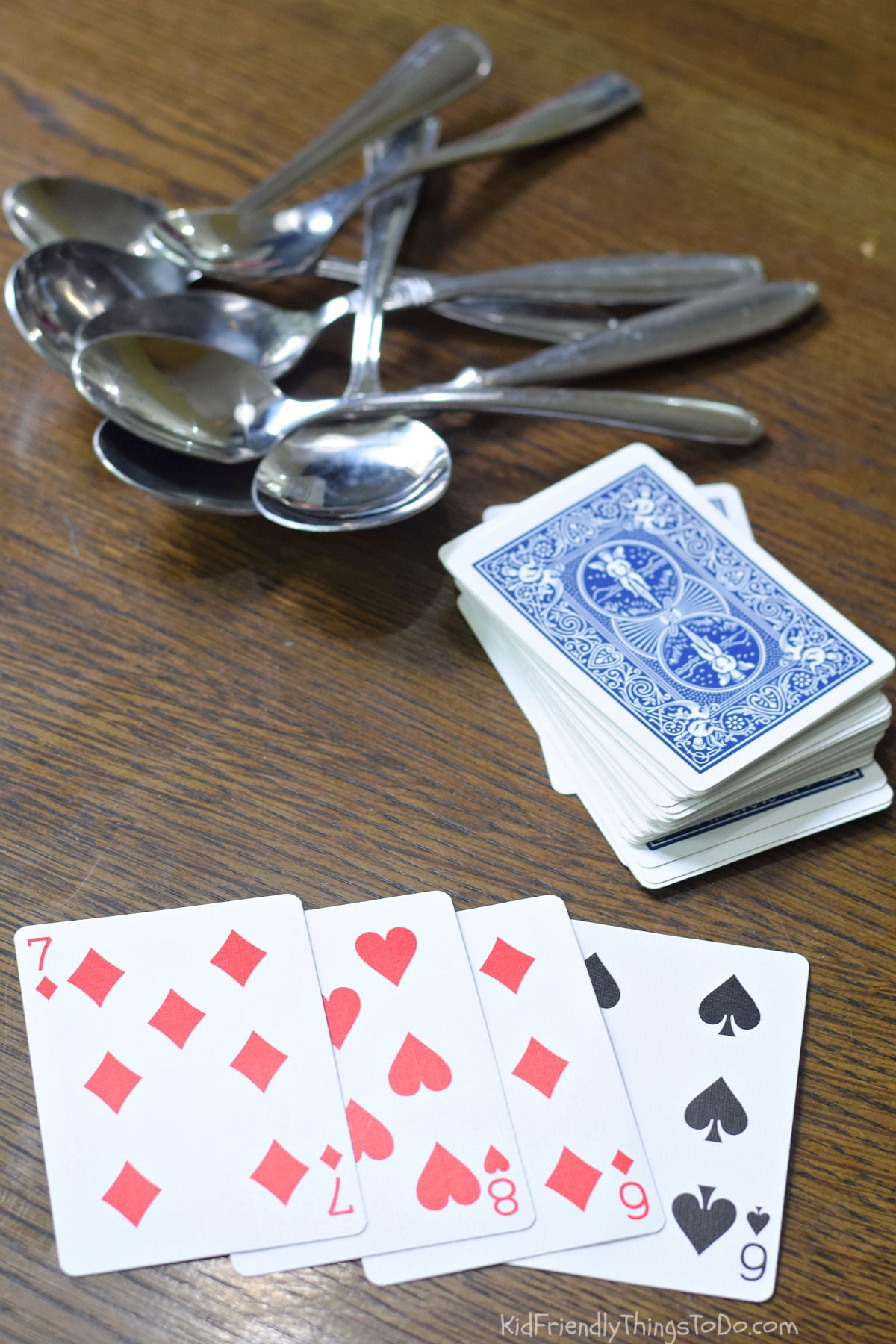 Deck of cards and spoons ready for the spoons card game