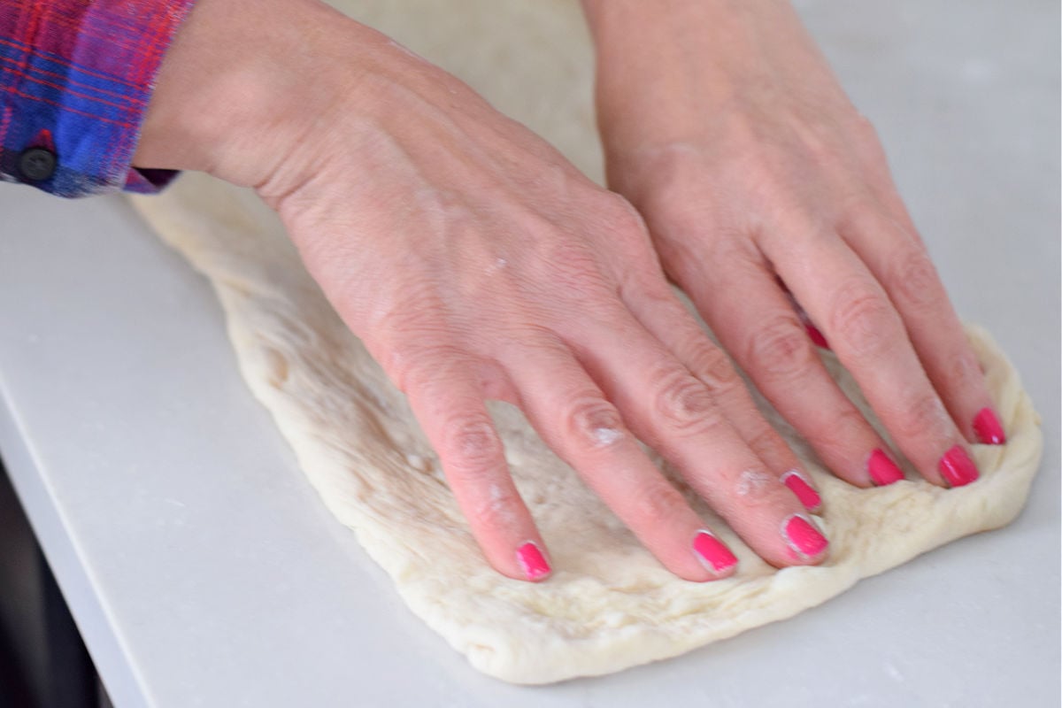 Stretching pizza dough