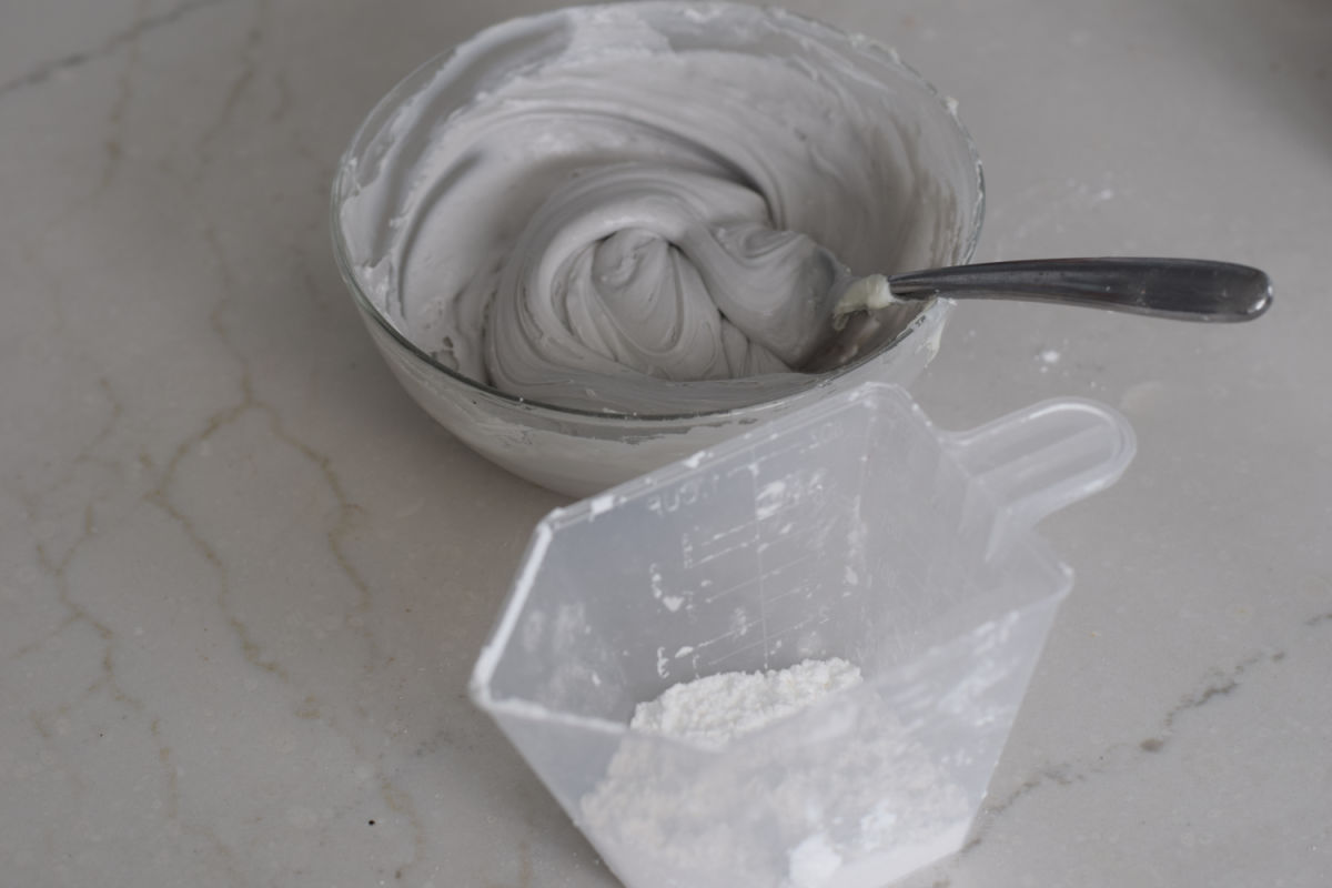 making silver frosting for Hocus Pocus brownies 