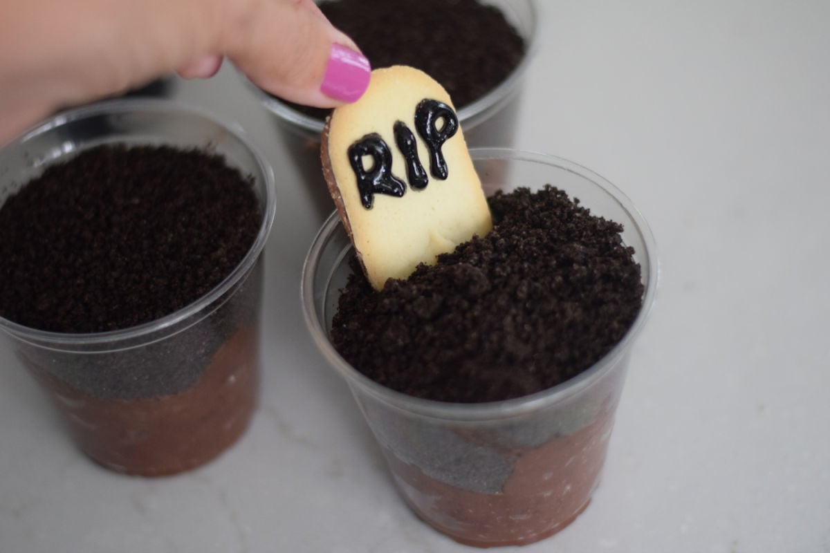 making Halloween pudding cups 