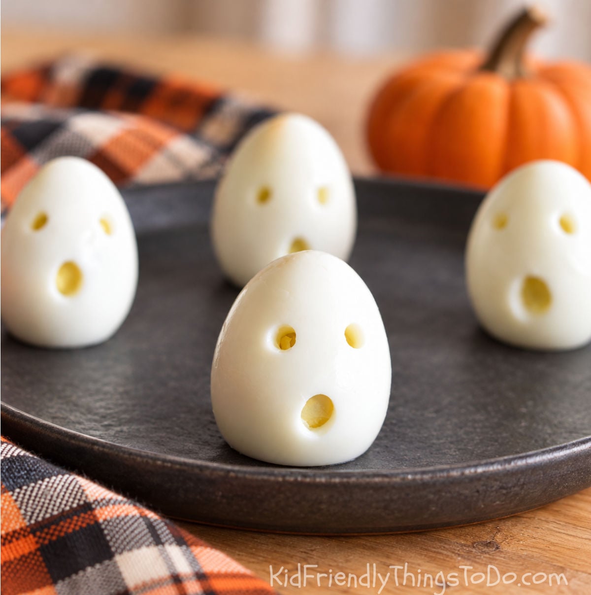 hardboiled eggs made into ghosts with eyes and a mouth