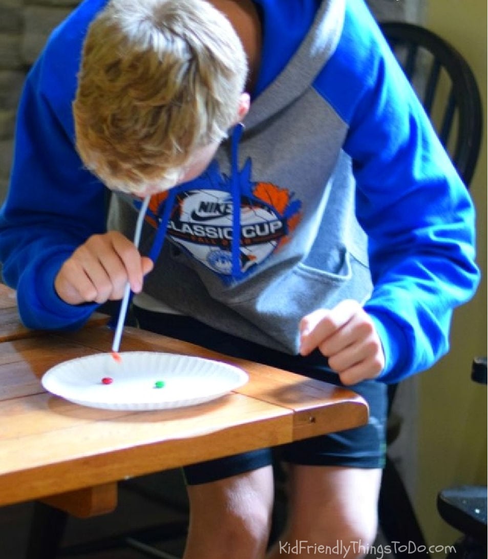 Suck It Up Thanksgiving Minute to Win It game using a straw and candy