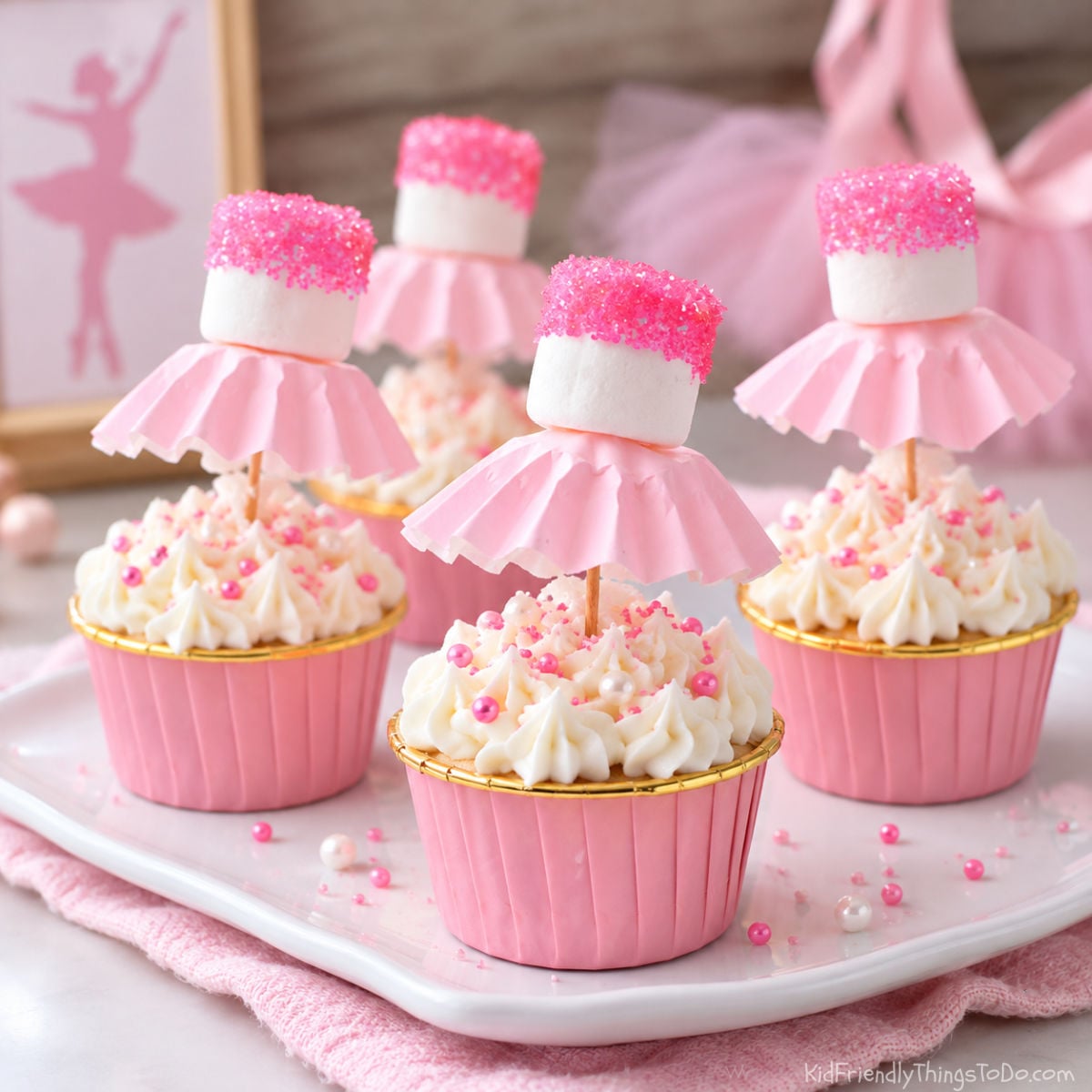ballerina cupcakes made with marshmallows, sugar, and cupcake wrappers on display for a birthday treat