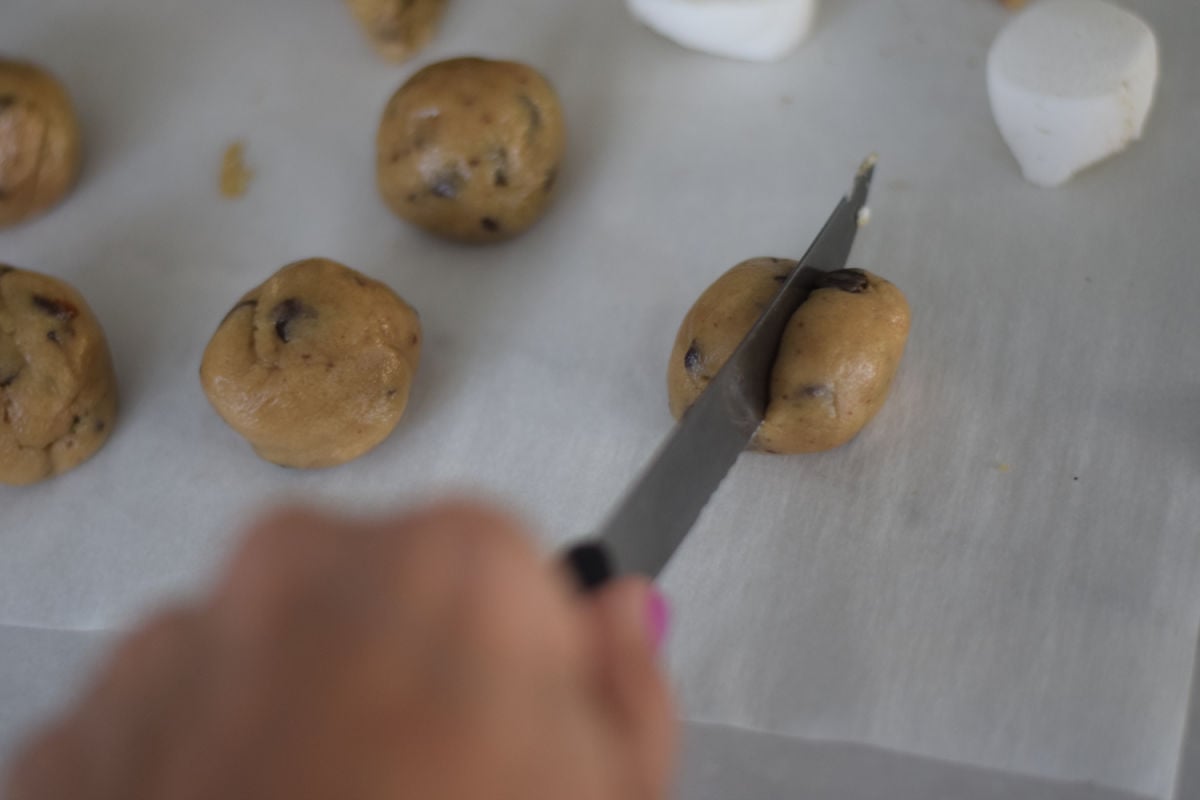 cutting cookie dough in half