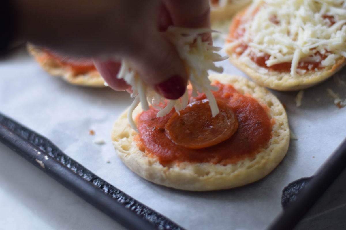 making English Muffin pizzas 