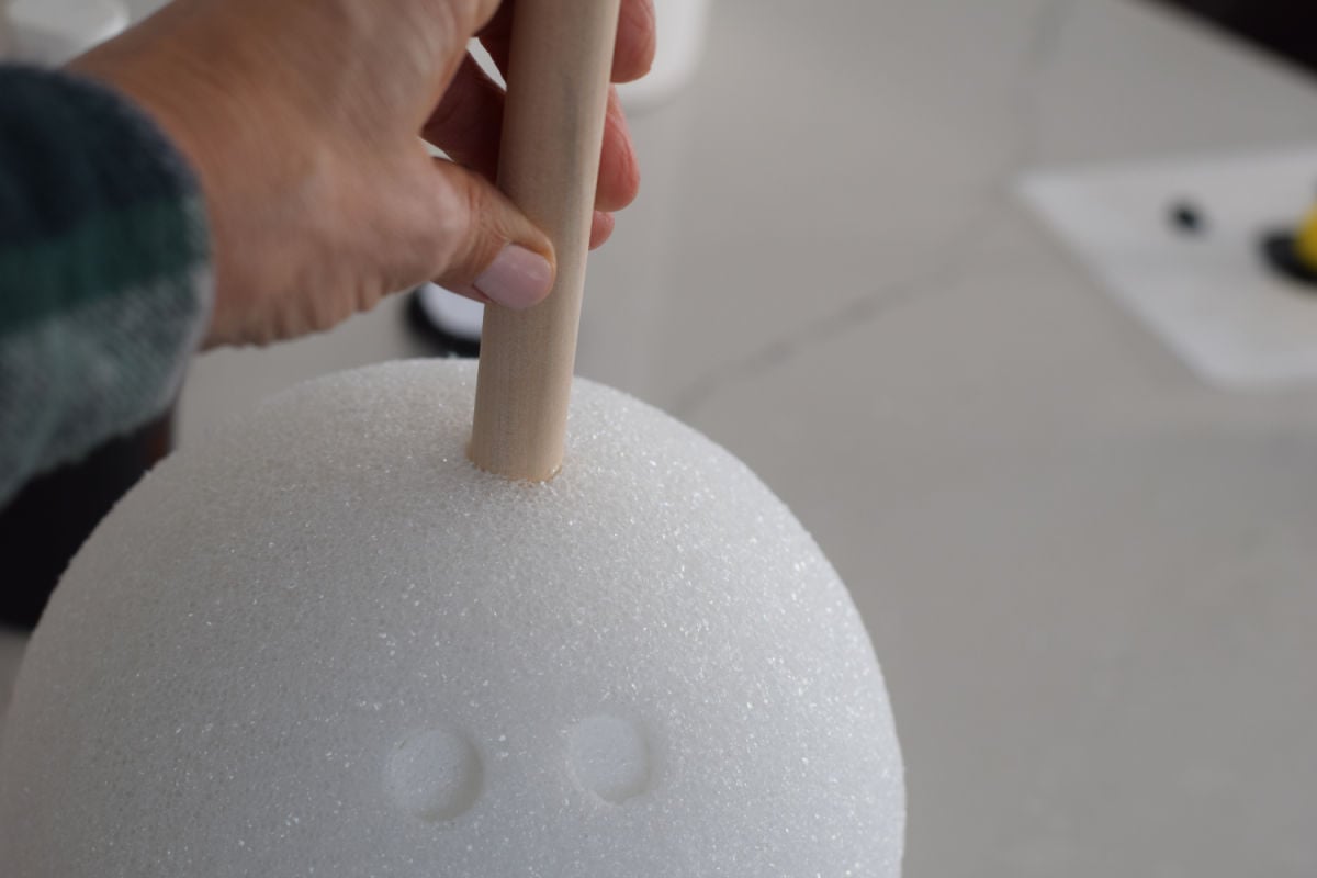 pushing dowel into foam ball for Olaf game 