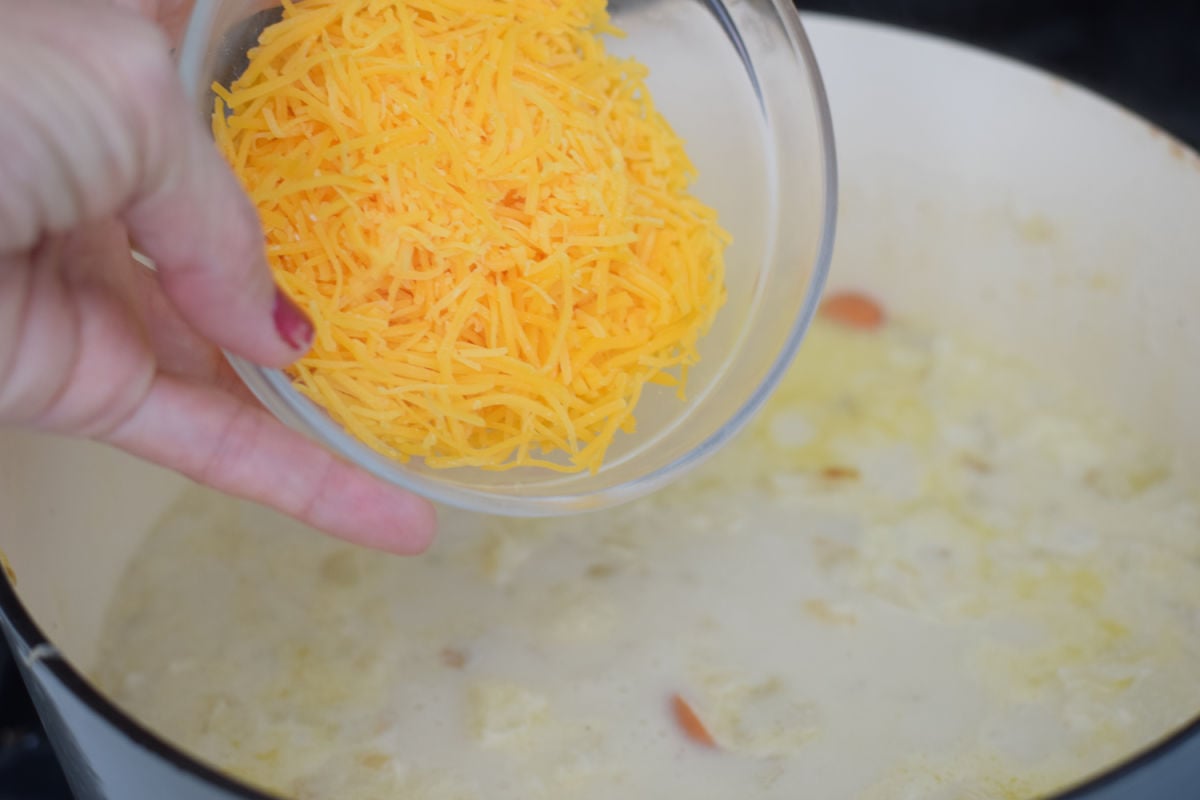 cauliflower soup adding cheese 