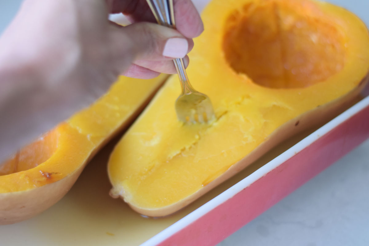 checking squash for tenderness