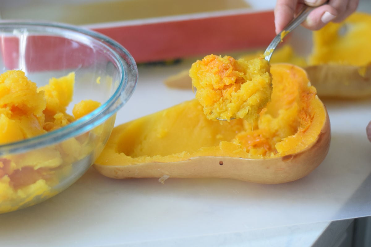 scooping butternut squash