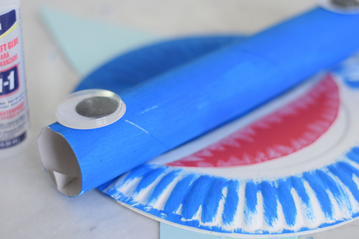 gluing eyes onto shark craft